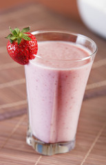 Smoothie strawberry served with fresh strawberry