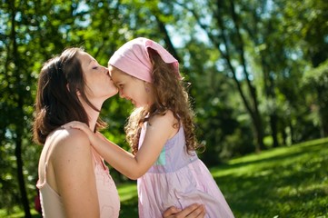 Love - mother kissing her child