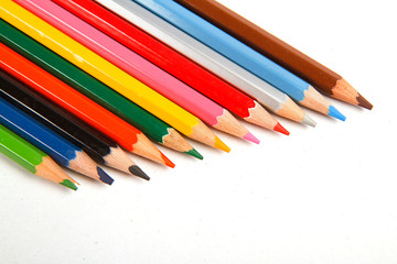 extreme closeup of crayons wave on white background