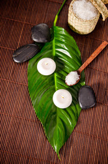 Spa still life with green leaf and lava stones