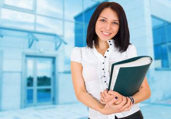 Portrait of happy smiling business woman with folder