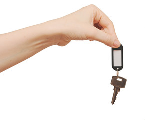 silver key with blank tag in hand isolated on white  space for y