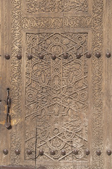 Ancient wooden door in Khiva, Uzbekistan