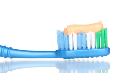 Toothbrush with paste isolated on white