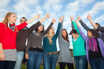 Obraz premium College Students with Thumbs Up