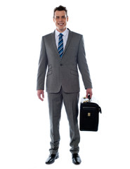 Business executive holding briefcase