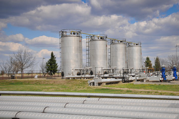 Greater white fuel tanks on a background of the blue sky
