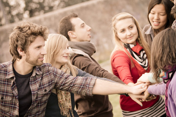 Multiracial Students with Hands on Stack