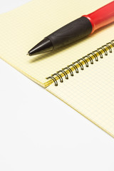 notebook and pen on a white background