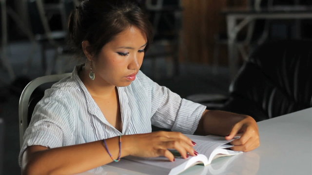 Young Asian Girl Reading Her Bible