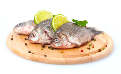 Fresh fishes with lime, parsley and spice