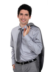 Man holding his suit jacket over his shoulder