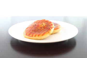 Chinese moon cake wedding dessert side dish on wooden table.