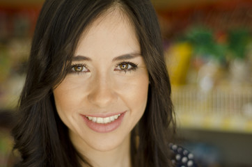 Portrait of cute woman at the grocery store