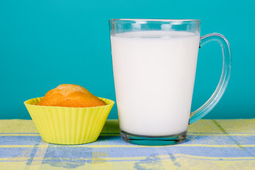 Glass of milk and cupcake