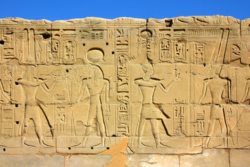 wall with ancient egypt images and hieroglyphics