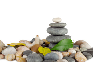 Pyramid of the round sea stones with leaves