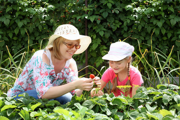 Mother and daughter gardening together