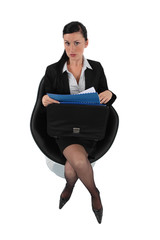 Businesswoman reviewing her files before a meeting