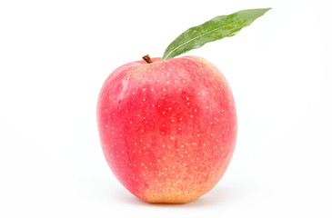 Healthy food. Fresh red apple with green leaf on a white backgro