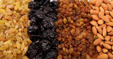 Mixed nuts and dried fruits. Almonds, raisins and prunes.