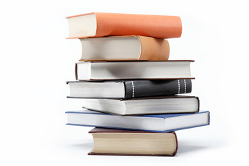 A stack of books on a white background.