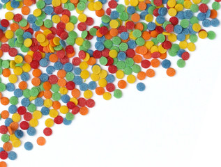 Colored sugar circles on a white background