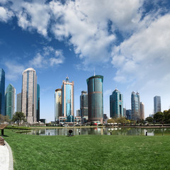 park and skyscrapers under the blue sky