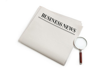 Business News and magnifying glass