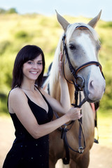 Obraz premium Young woman with a horse