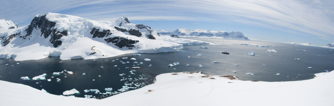 Antarctic panorama with ocean and mountains