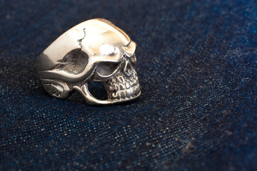 The metal skull on denim