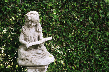 Ancient statues and leaves background
