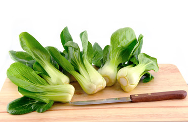 bok choy leaf on chopping board