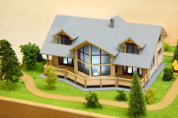 Small model of cottage with exterior - trees, bushes and path