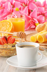 Breakfast with coffee, rolls, egg, orange juice, muesli and chee