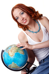 Young woman with a globe