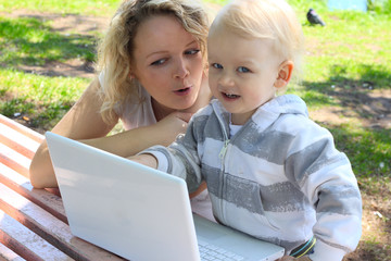 Mother and child with laptop