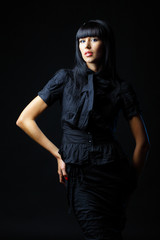 Portrait of a beautiful young sexy woman in black clothing