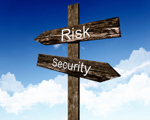 Two road signs against blue sky