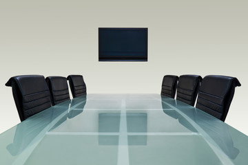 Meeting room with glass table , black chair and television