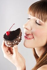 Beautiful brunette woman with a cake