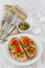 toasts with cut pepper on the plate