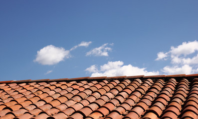 Shingled Roof with Blue Sky Background