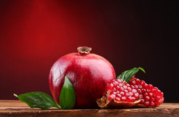 ripe pomegranate fruit with leaves