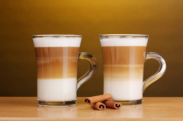Fragrant сoffee latte in glass cups and cinnamon