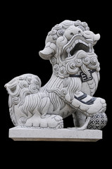 Statue of a lion on a black background