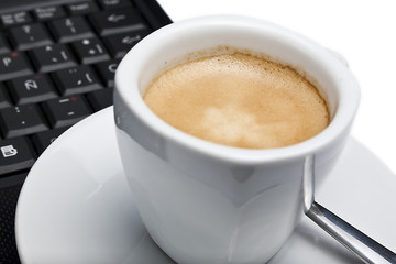 Coffee cup and laptop