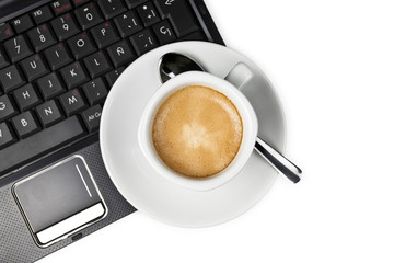 Coffee cup and laptop