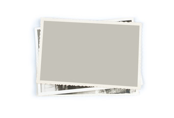 Stack of old photos on white background